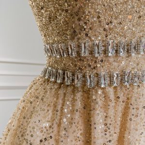 A sequined tulle gown is suitable for an evening event.