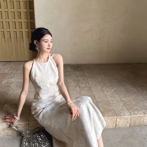 Sleeveless, waist-cinching, slimming fishtail dress with halter neck