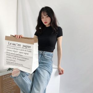 Wear a fitted high-waisted cropped T-shirt as an inner layer